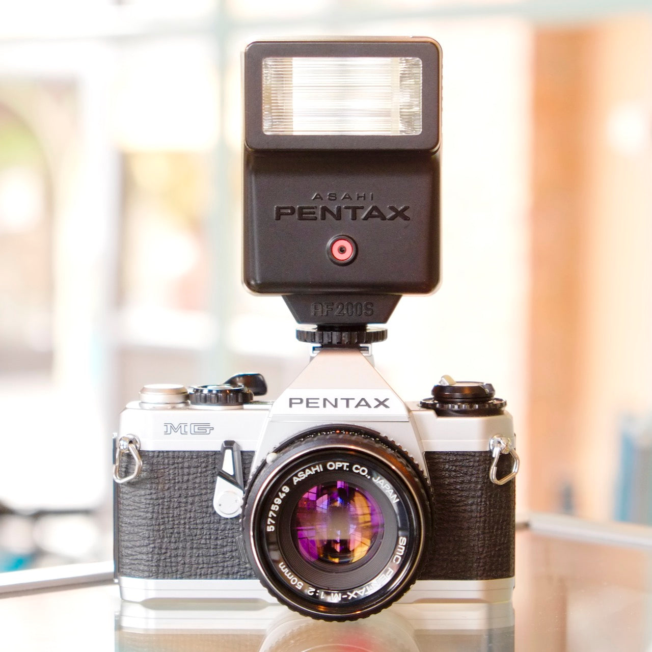 Pentax MG with SMC Pentax-M 50mm f2 lens and flash